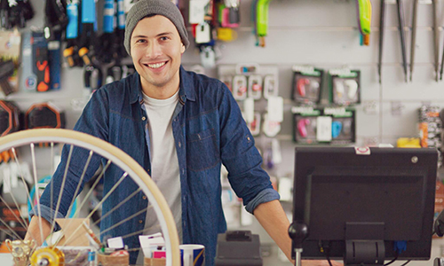 Bike shop owner behind his EPoS System