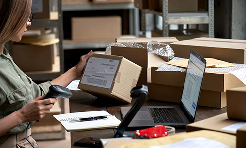 Store owner shipping goods to a website customer